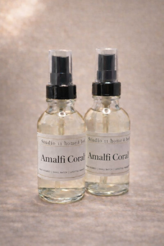 Mineral • Coastal • Sophisticated

Amalfi Coral is a modern coastal fragrance inspired by mineral-rich shorelines and sun-warmed air. Fresh marine notes open the scent, layered with subtle citrus brightness and softened by airy florals. An earthy base of moss and warm woods grounds the fragrance, creating depth, balance, and quiet elegance.

Housed in a 4 oz glass bottle, this everywhere mist is crafted with a skin-safe body and room spray formula featuring conditioning ingredients such as aloe and glycerin