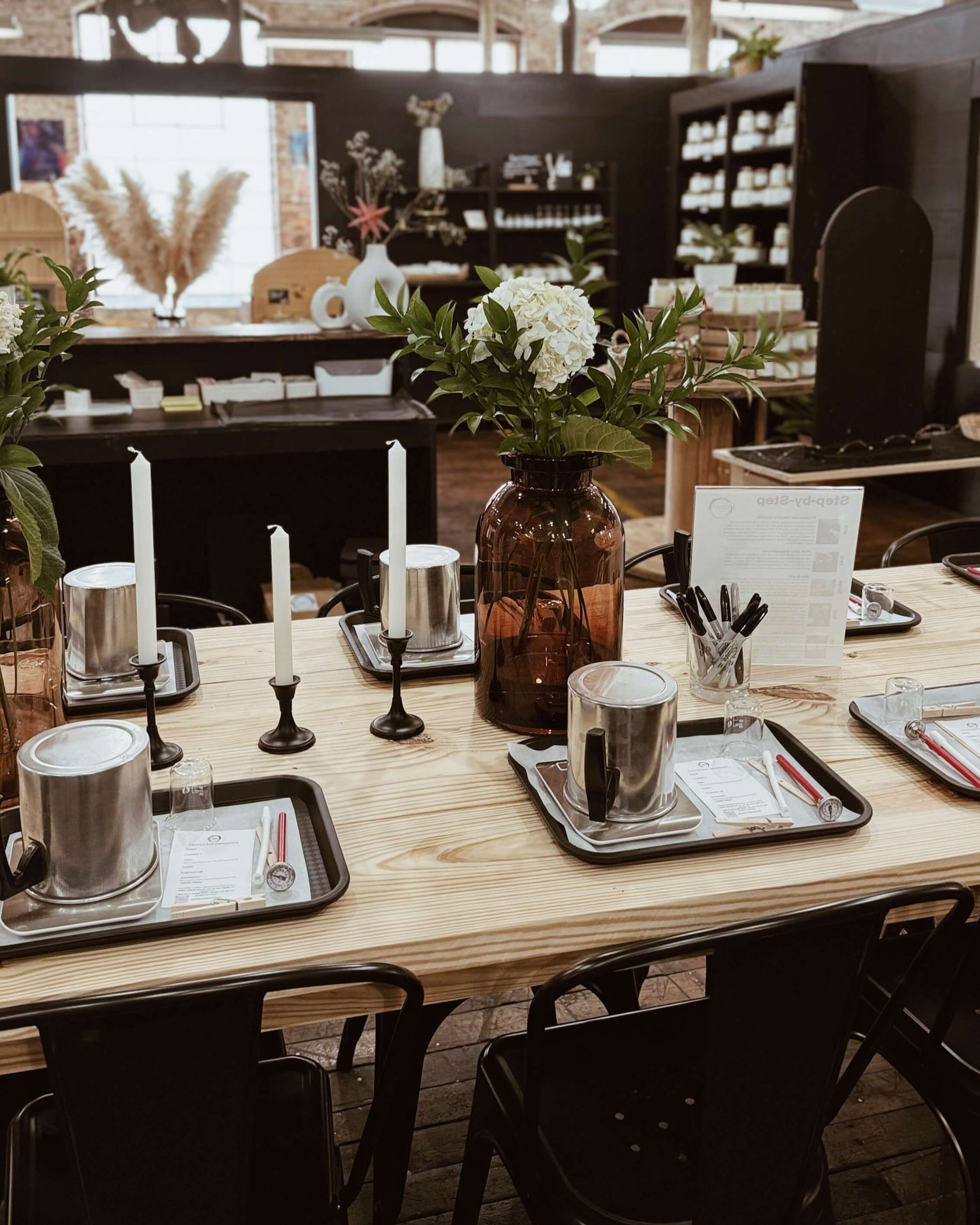 Table set for Making your own candle bar experience at Studio 11 Home and Body Huntsville AL