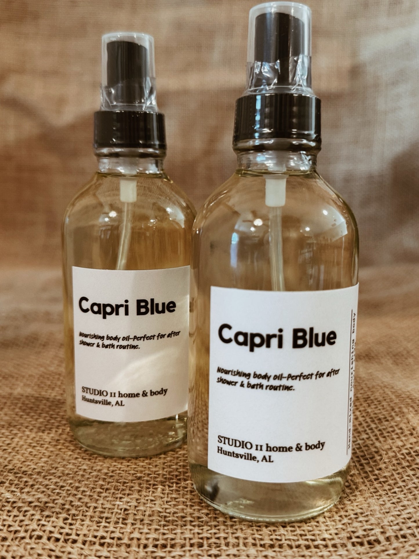 Capri Blue • Nourishing Body Oil
Clean, non-toxic fragrance. Luminous, hydrated skin.

A sun-drenched escape—Capri Blue opens with a bright, sparkling blend of lemon and mandarin blossom, softened by a breath of ocean air. As it settles, delicate waterlily and palm leaf unfold, layered with creamy coconut and soft coastal greens. The finish is warm and grounding—driftwood, sheer musk, and  lingering on the skin like sun-warmed air after a day by the sea.

This is not just fragrance—it’s atmosphere.
