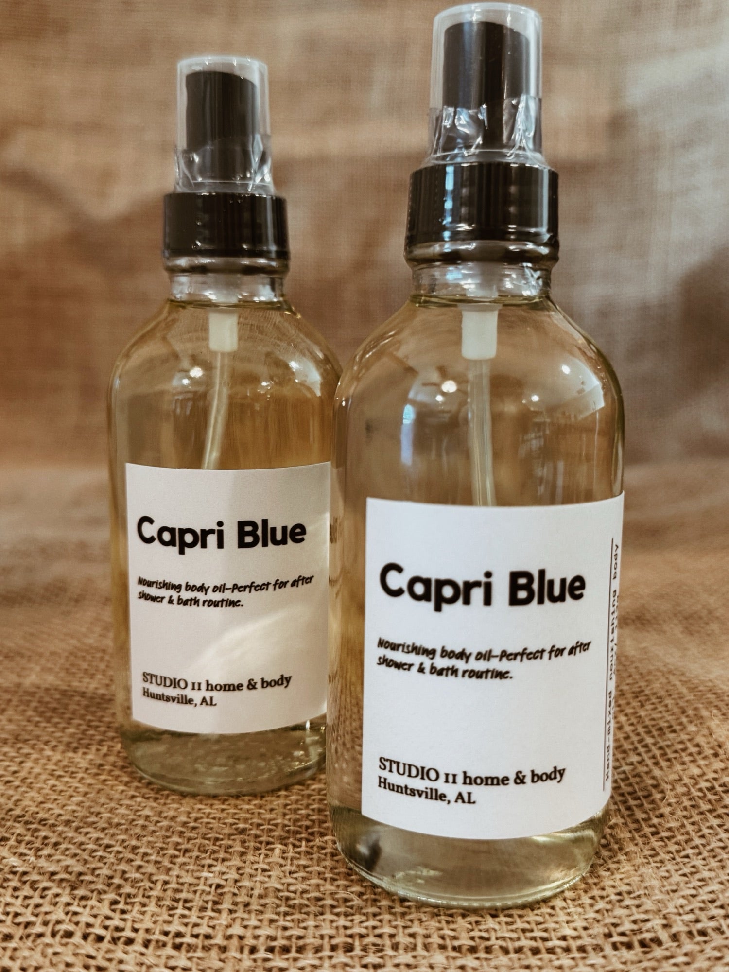 Capri Blue • Nourishing Body Oil
Clean, non-toxic fragrance. Luminous, hydrated skin.

A sun-drenched escape—Capri Blue opens with a bright, sparkling blend of lemon and mandarin blossom, softened by a breath of ocean air. As it settles, delicate waterlily and palm leaf unfold, layered with creamy coconut and soft coastal greens. The finish is warm and grounding—driftwood, sheer musk, and  lingering on the skin like sun-warmed air after a day by the sea.

This is not just fragrance—it’s atmosphere.