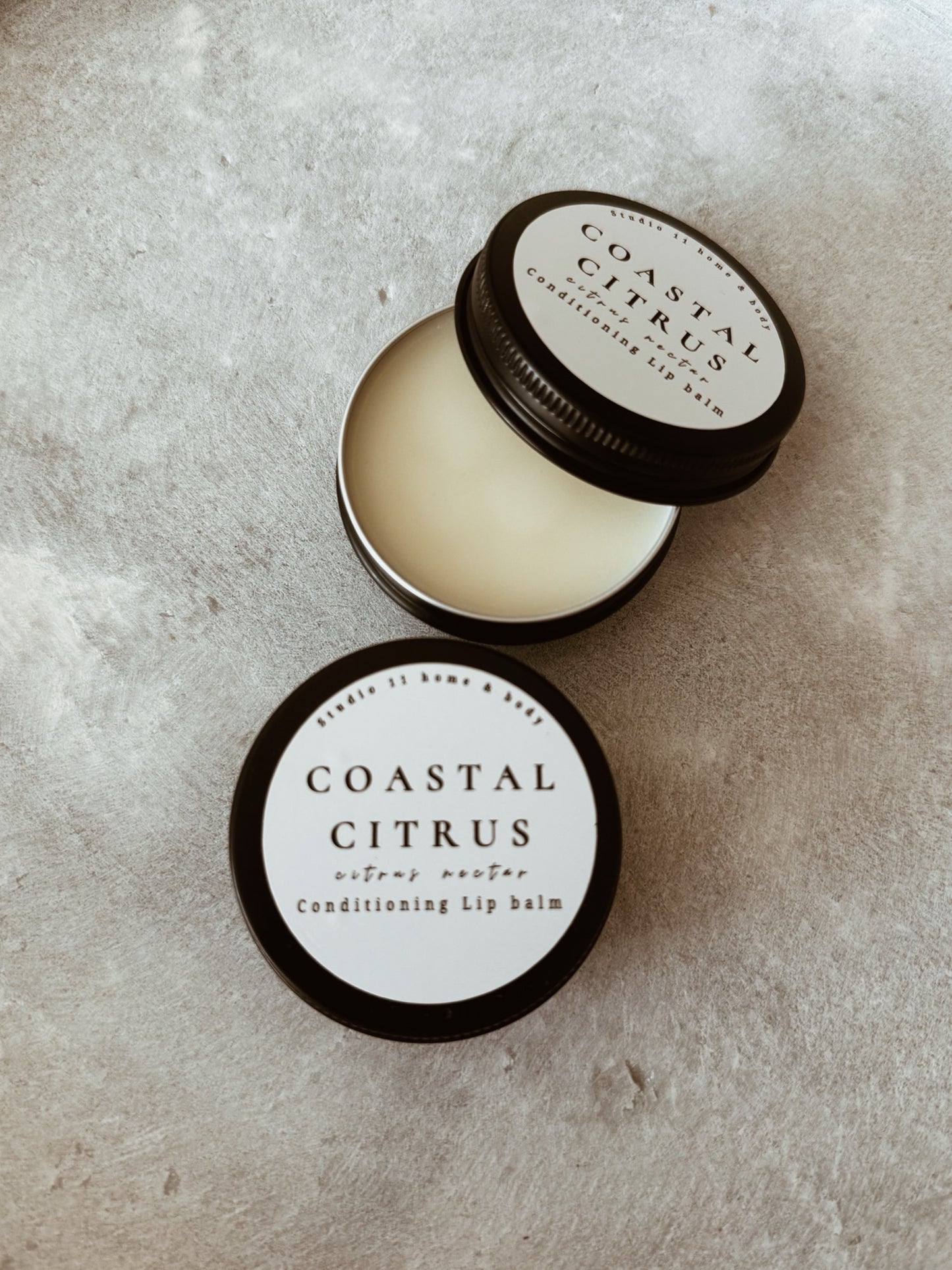 Crafted with rich shea butter, beeswax, jojoba oil, fractionated coconut oil, and vitamin E, this hydrating lip balm melts instantly into the lips, locking in moisture and helping restore dry, chapped skin. The result is a silky, lightweight finish with long-lasting hydration and a natural glow.

Infused with a vibrant blend of coconut, pineapple, and orange, this citrus lip balm offers a clean, refreshing scent that feels like a coastal escape — bright, juicy, and subtly sweet without ever being overpoweri