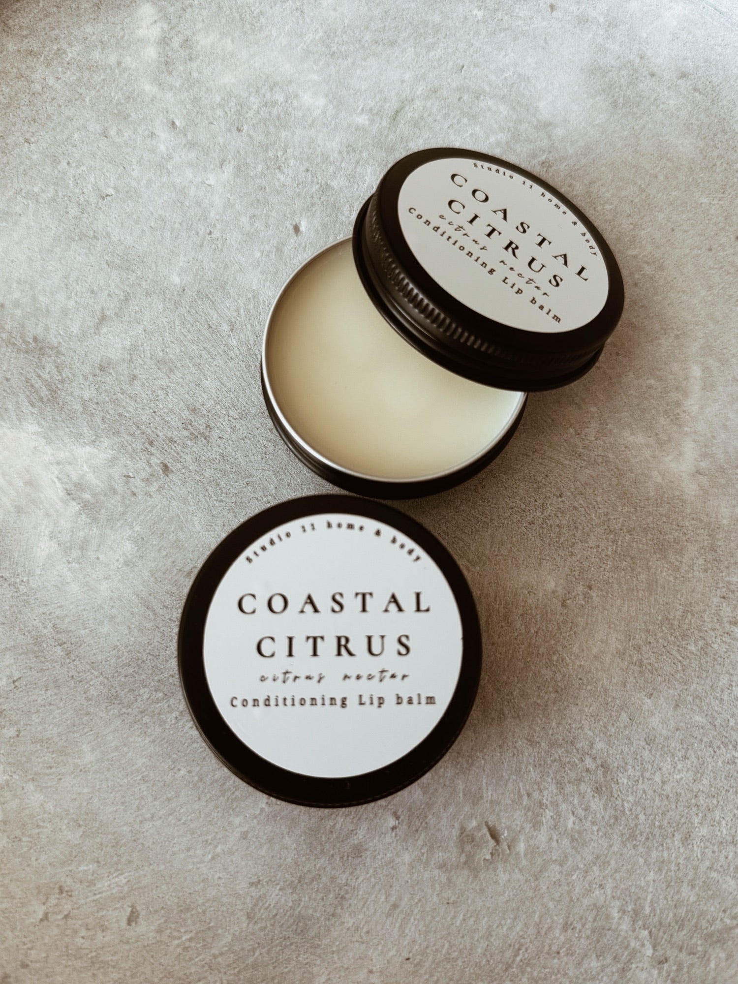 Crafted with rich shea butter, beeswax, jojoba oil, fractionated coconut oil, and vitamin E, this hydrating lip balm melts instantly into the lips, locking in moisture and helping restore dry, chapped skin. The result is a silky, lightweight finish with long-lasting hydration and a natural glow.

Infused with a vibrant blend of coconut, pineapple, and orange, this citrus lip balm offers a clean, refreshing scent that feels like a coastal escape — bright, juicy, and subtly sweet without ever being overpoweri