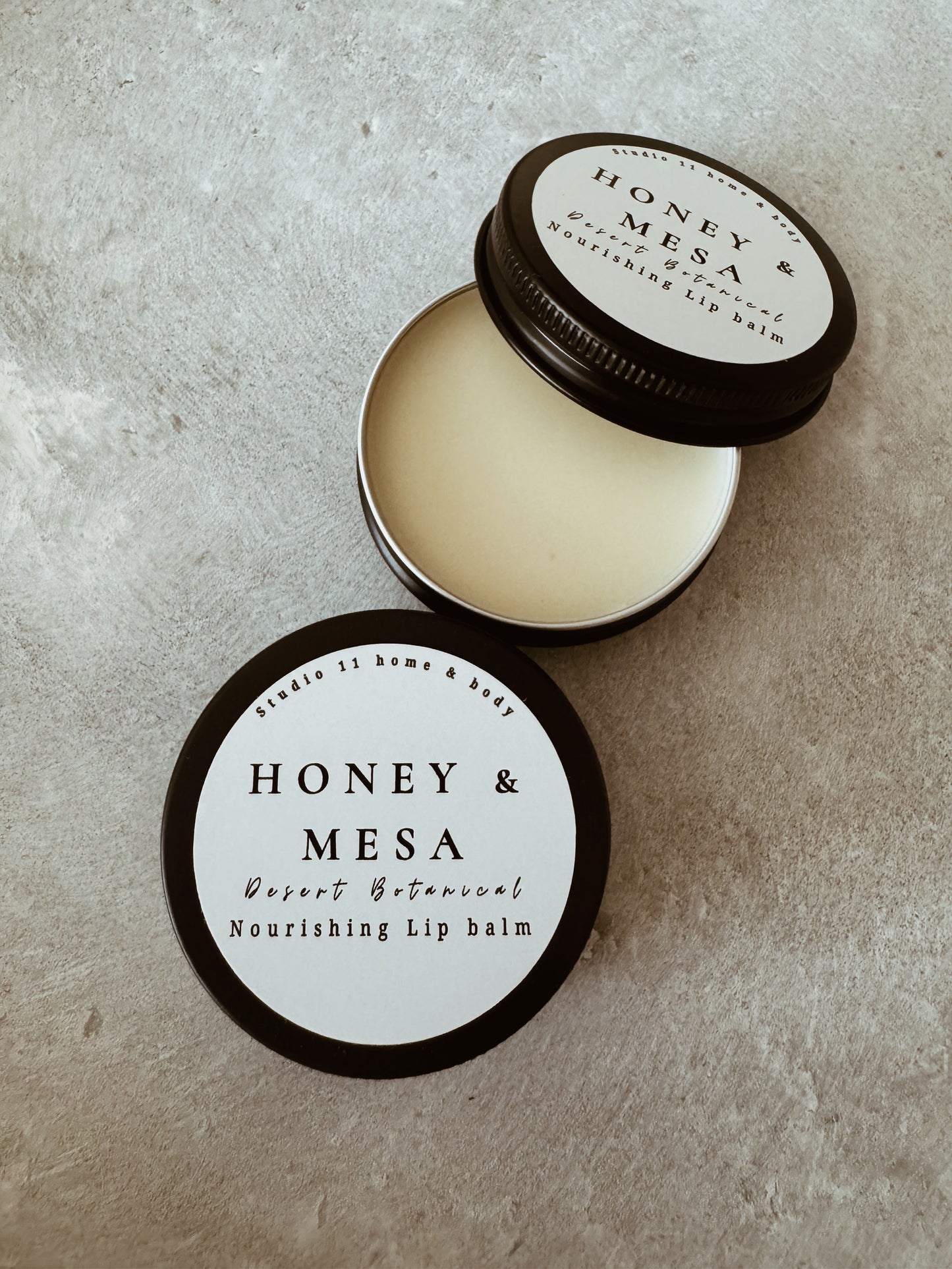 Formulated with rich shea butter, protective beeswax, jojoba oil, fractionated coconut oil, and vitamin E, this luxury lip balm melts effortlessly into the skin, delivering long-lasting hydration without a heavy or greasy feel. Lips are left soft, supple, and naturally radiant.

Infused with a comforting blend of warm vanilla, golden honey, and bright orange, Honey Mesa offers a softly sweet, sun-warmed scent that feels both grounding and indulgent — like a slow, golden hour moment in the desert.
